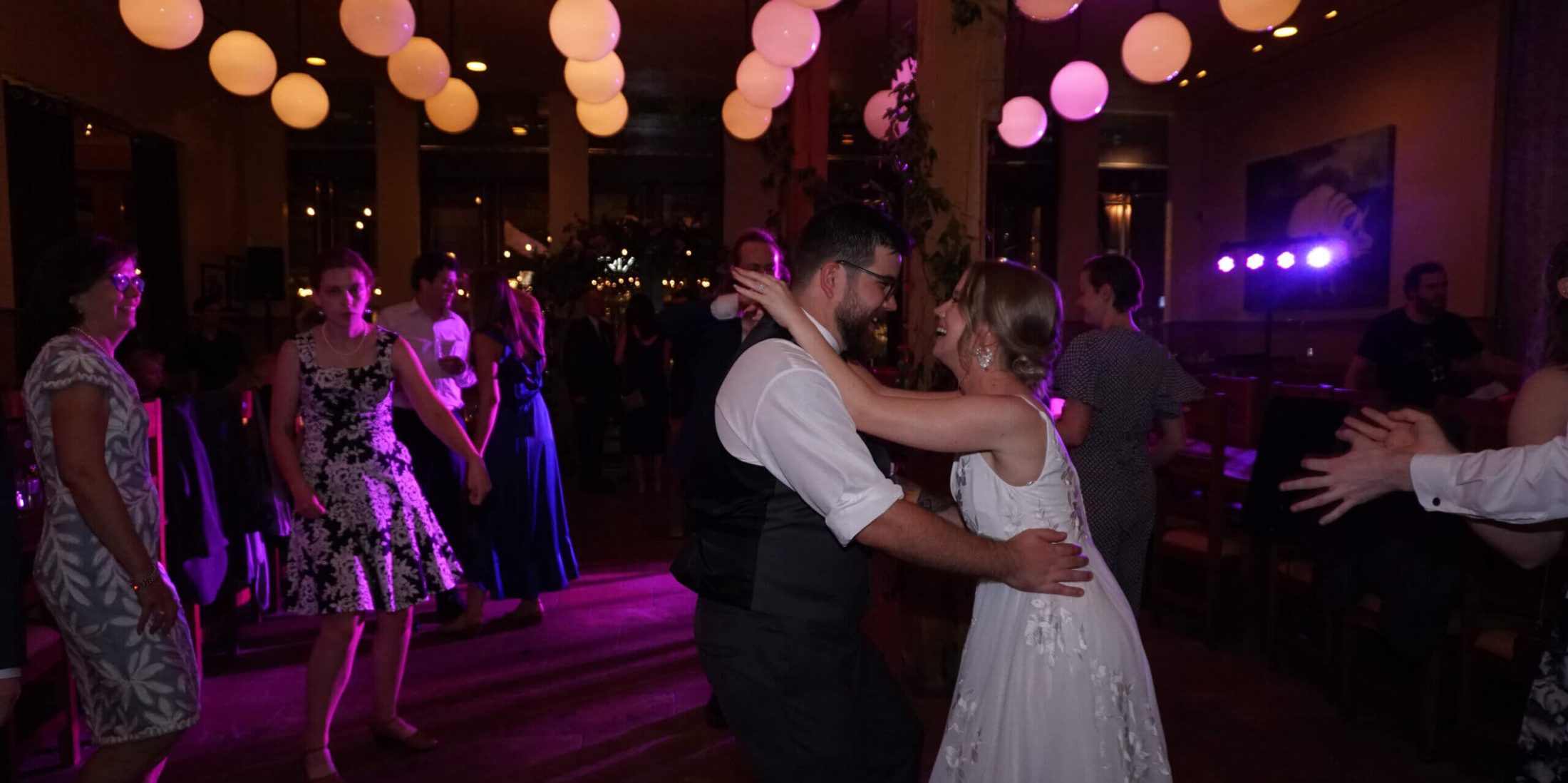 Bride and groom sharing their first dance at their wedding at The Publican, with music by Paul Michaels Events, a Chicago wedding DJ company