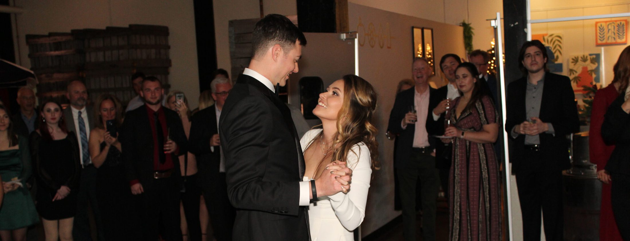 Bride and groom sharing their first dance at their post elopement party at Rhine Hall in Chicago, music and DJ services provided by Paul Michaels Events Company