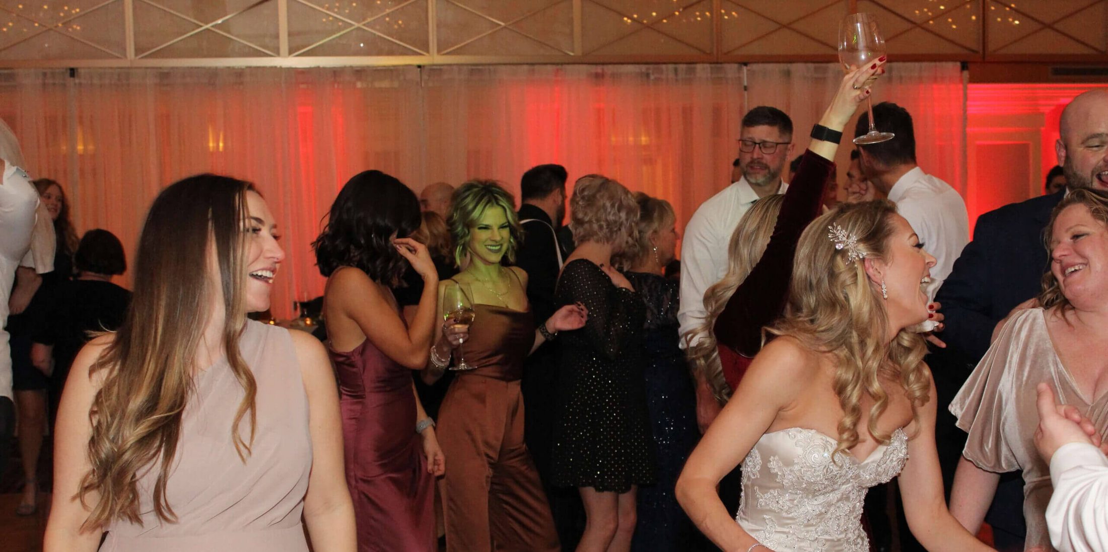 Group of people on the dance floor at JW Marriott Chicago, dancing to music by Paul Michaels Events, the most trusted wedding DJ in Chicago