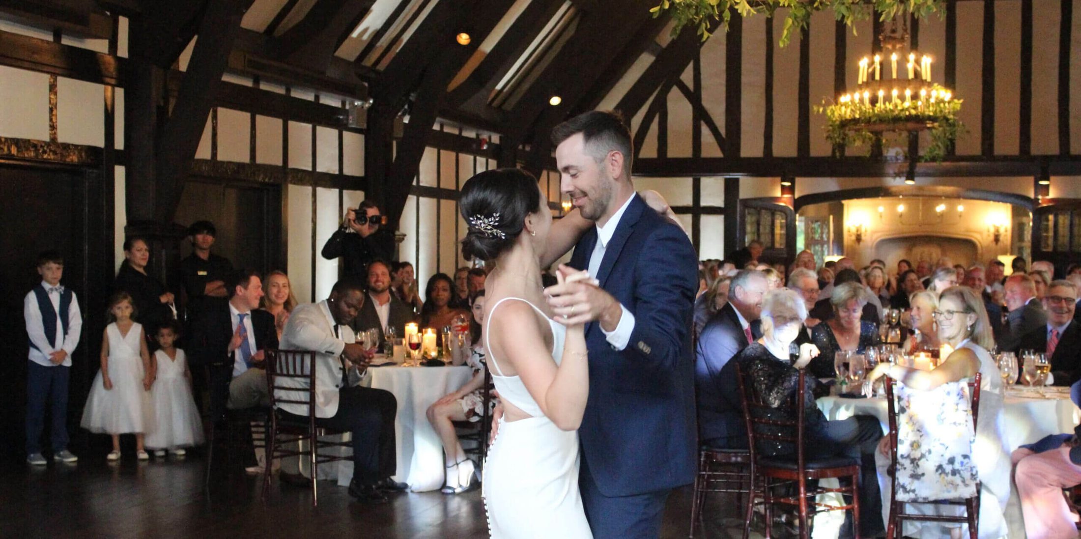 Bride and groom sharing their first dance at Glen View Club in Golf, Illinois, with music provided by Paul Michaels Events, a Chicagoland wedding DJ company