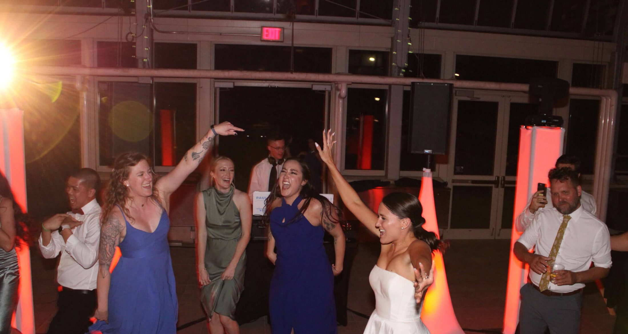 A bride and her guests dancing on the dance floor to the best DJ entertainment services in Chicago, Paul Michaels Events