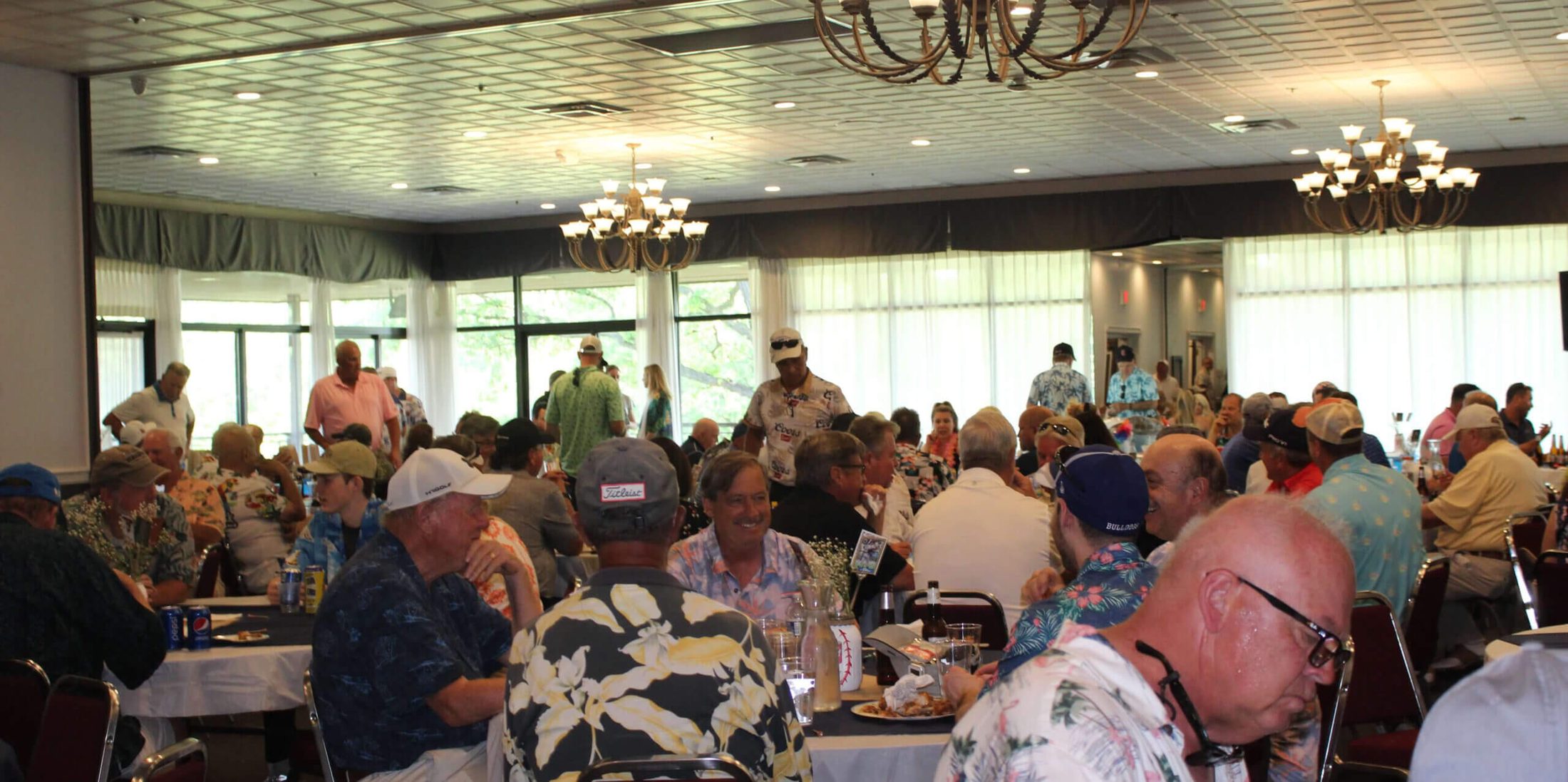 A room full of guests celebrating the life of Bill, with Celebration of Life DJ Services by Paul Michaels Events