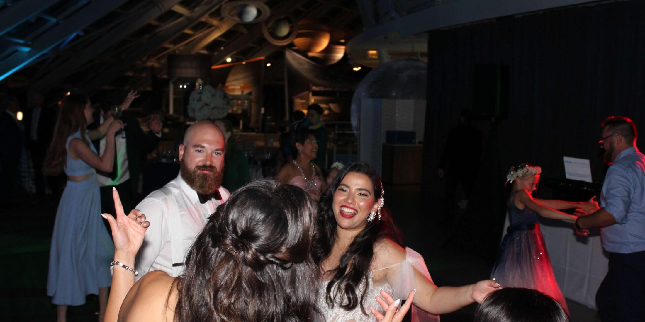 Bride and groom on the dance floor mingling with their guests while dancing to the best Chicago Wedding Entertainment DJ Services, Paul Michaels Events