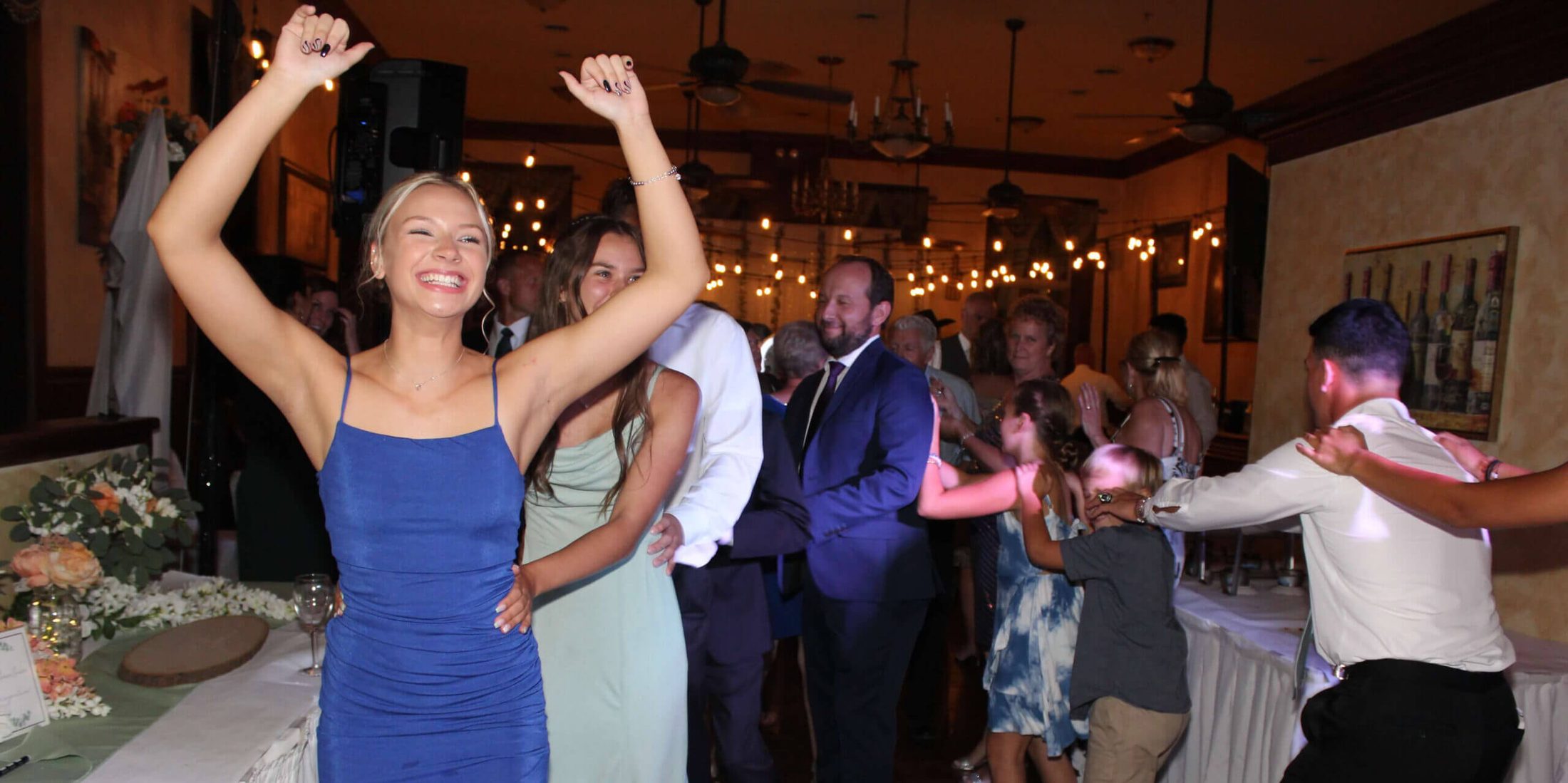 A conga line moving across the space at La Dolce Vita of Lemont, with the best Chicagoland wedding entertainment DJ services provided by Paul Michaels Events