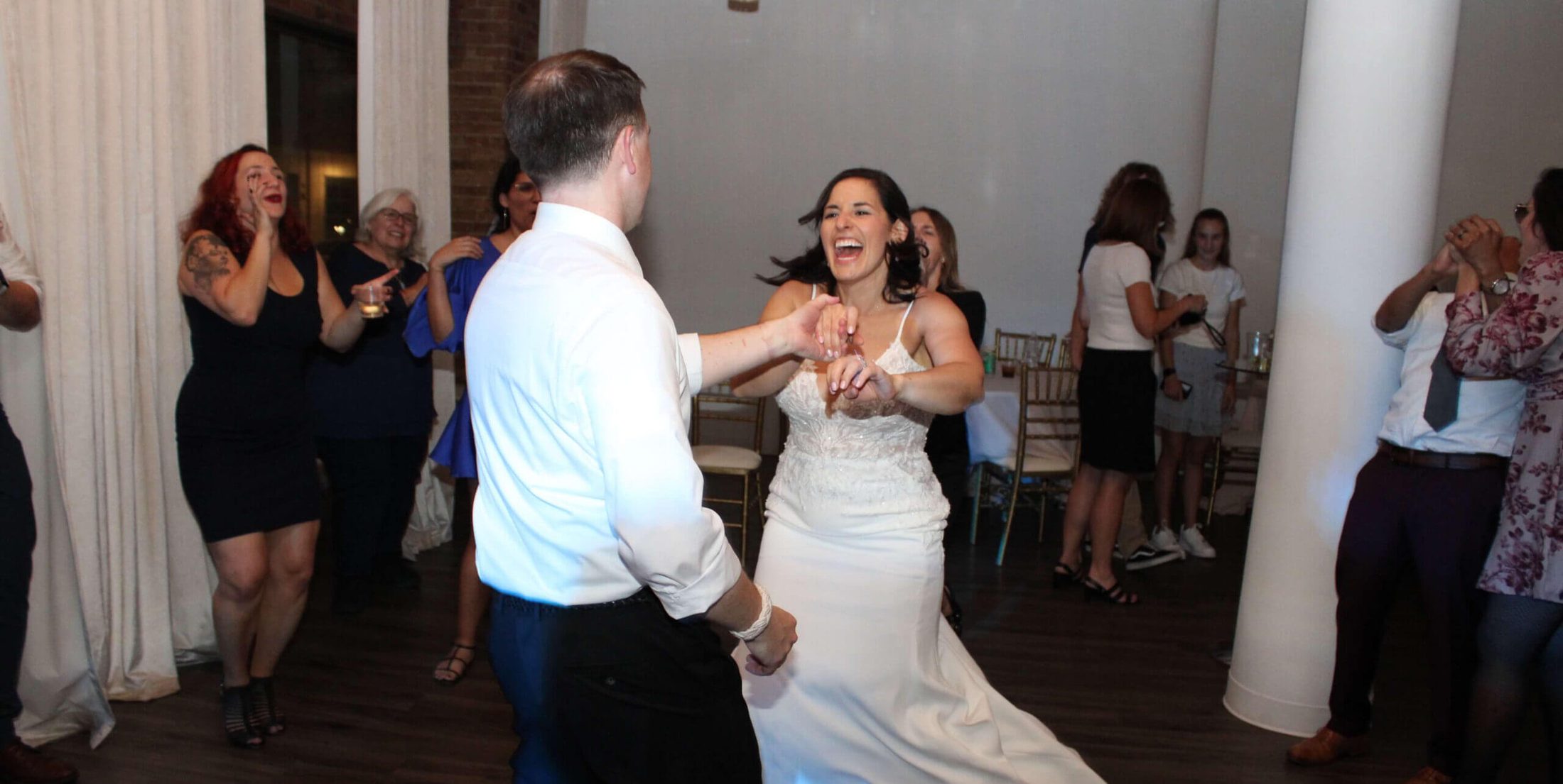 Bride and groom dancing and having the time of their lives