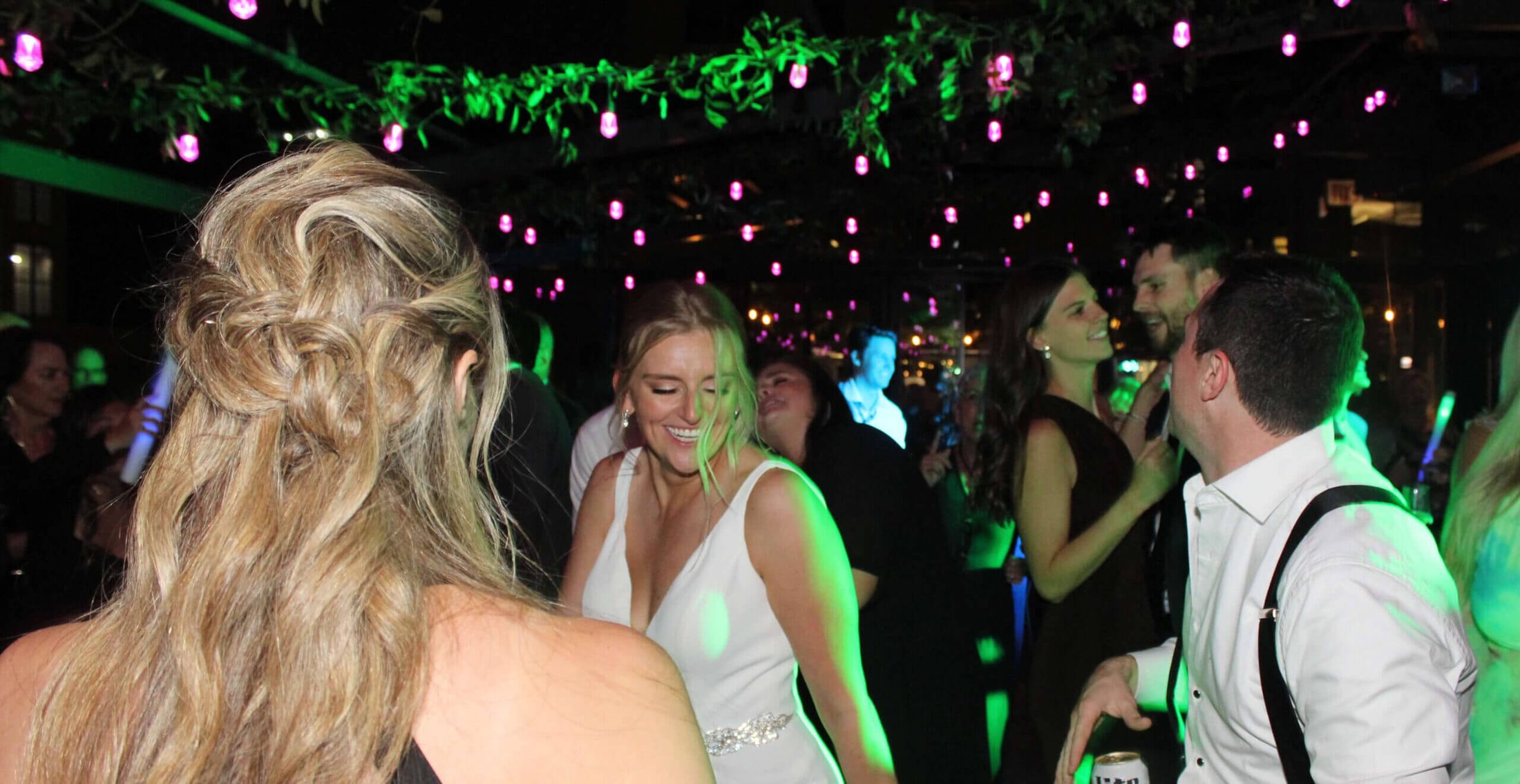 Bride and groom in the middle of the dance floor dancing to the beats of the best Chicago DJ wedding company
