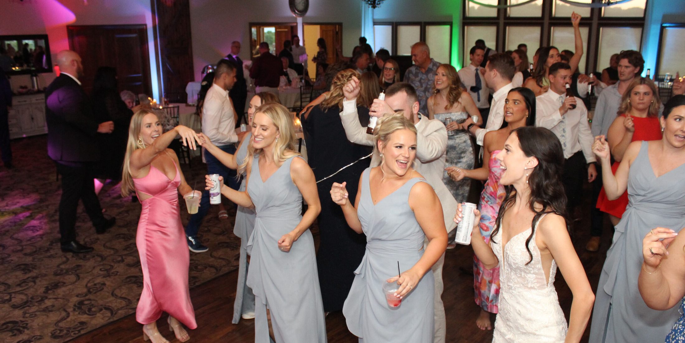 A bride and her guests on the dance floor at White Tail Ridge Golf Club,