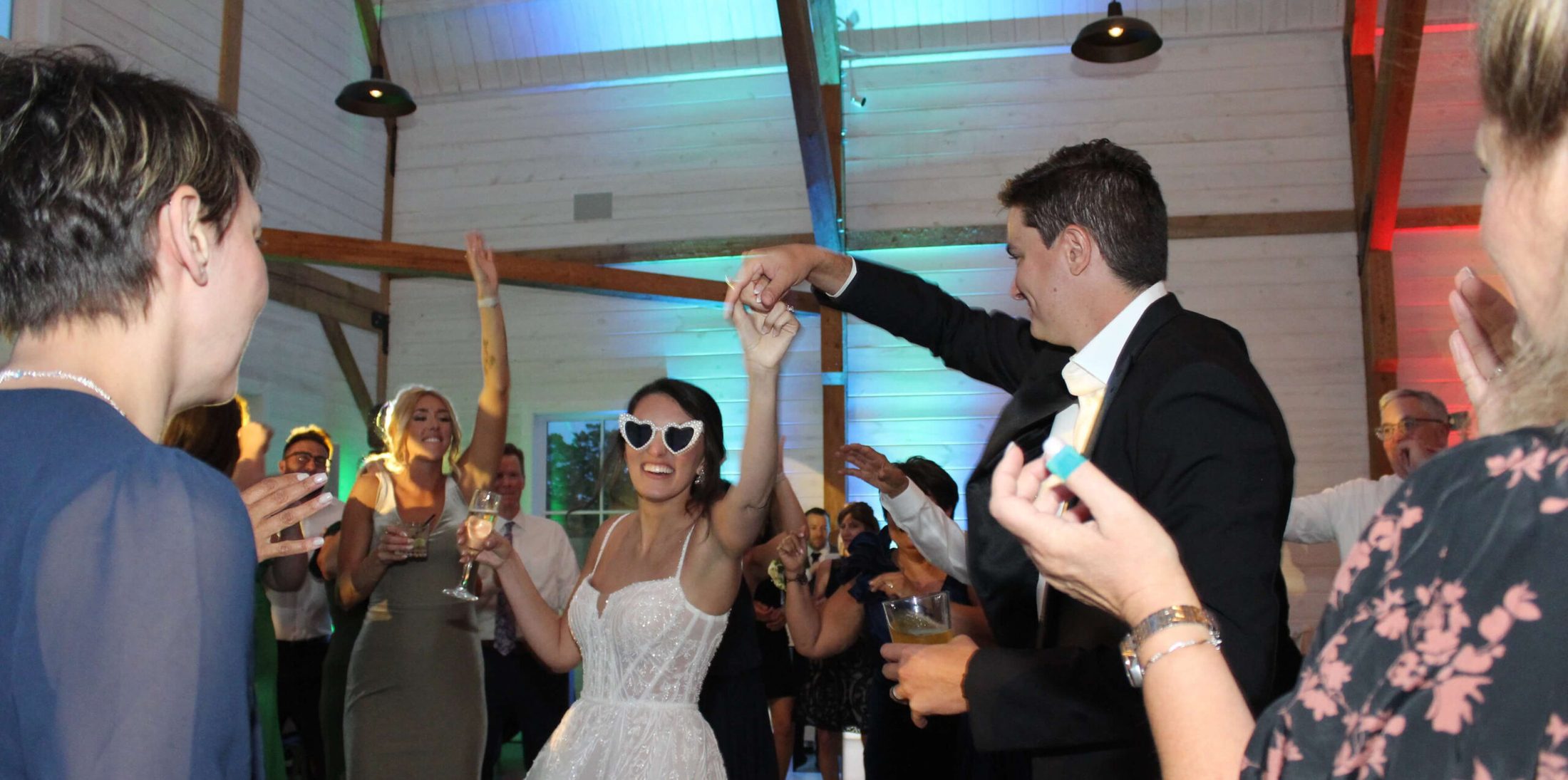 A bride and groom dancing on their own wedding
