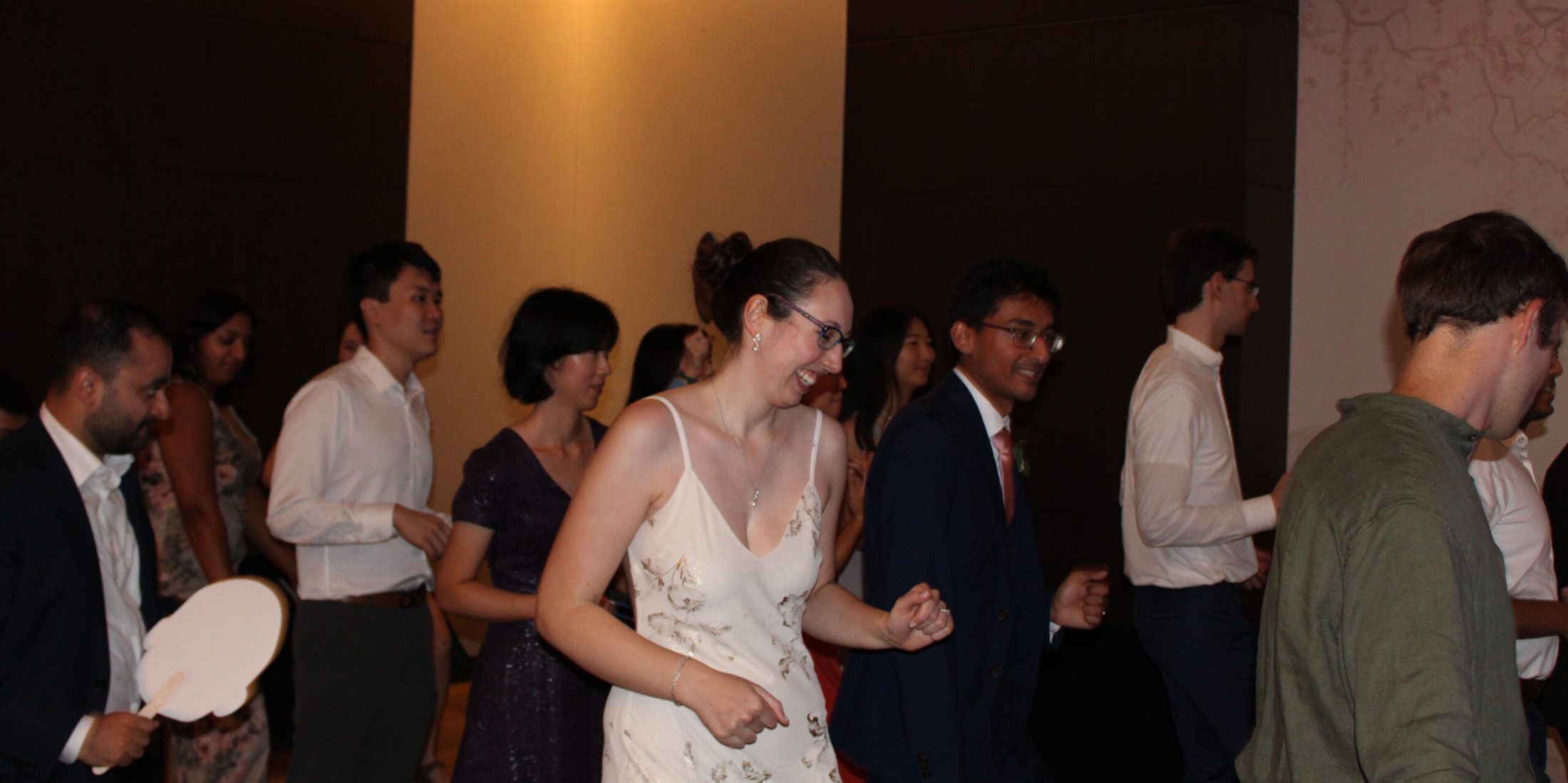 Bride and groom dancing with loved ones