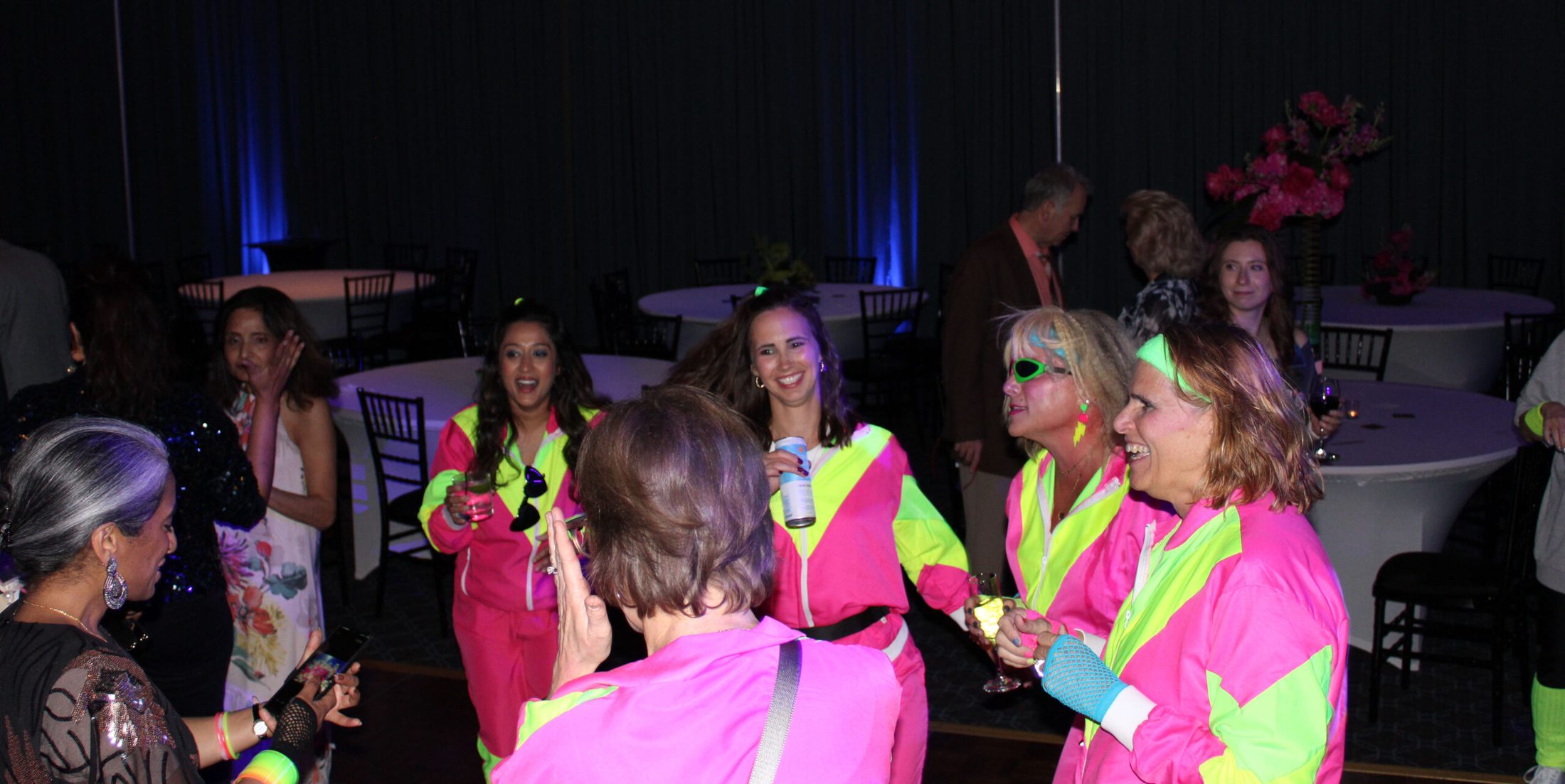 Group of people dressed in 80s themed attire