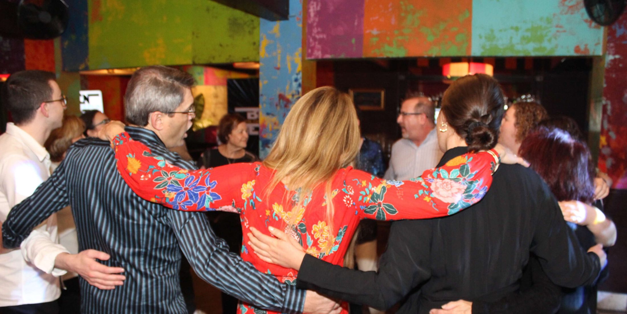 Group of people swaying to music Bar Mitzvah DJ company in Chicago