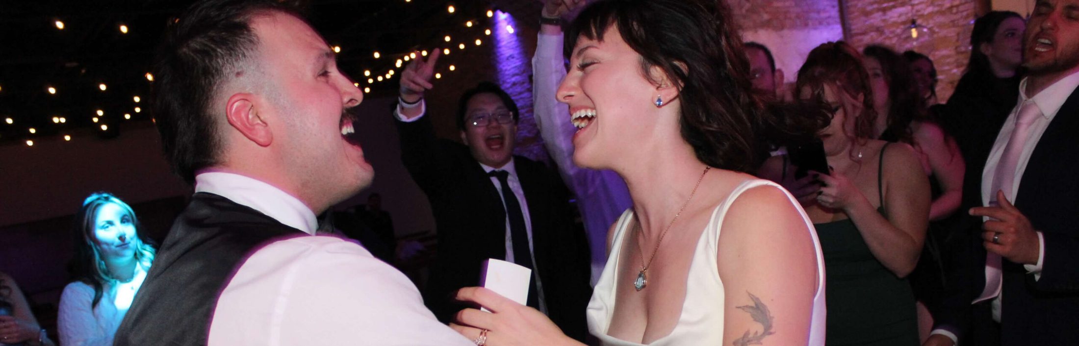 Bride and groom dancing to the best wedding DJ