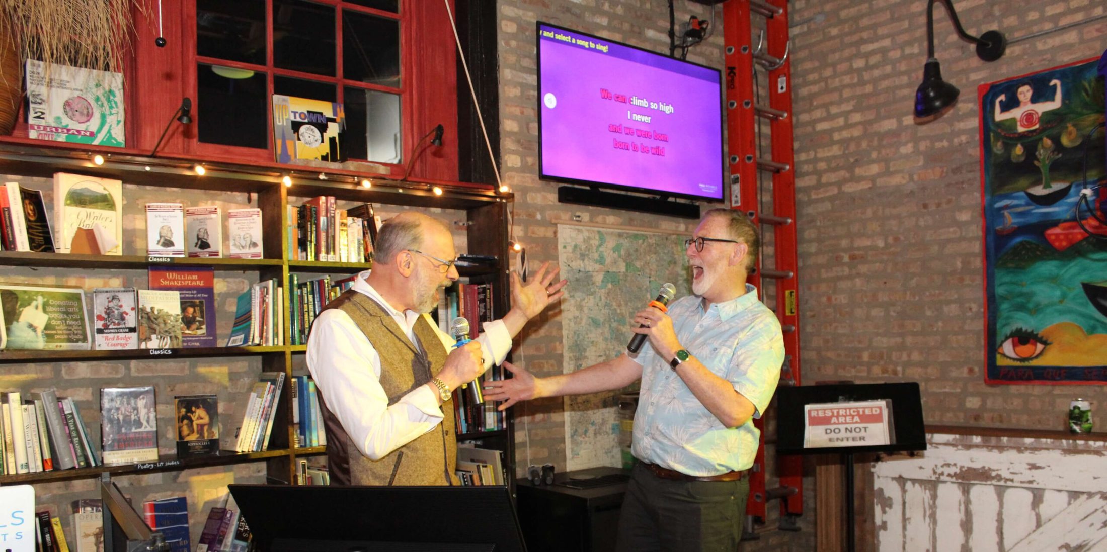 Two gentlemen singing karaoke at Kibbitznest in Chicago's