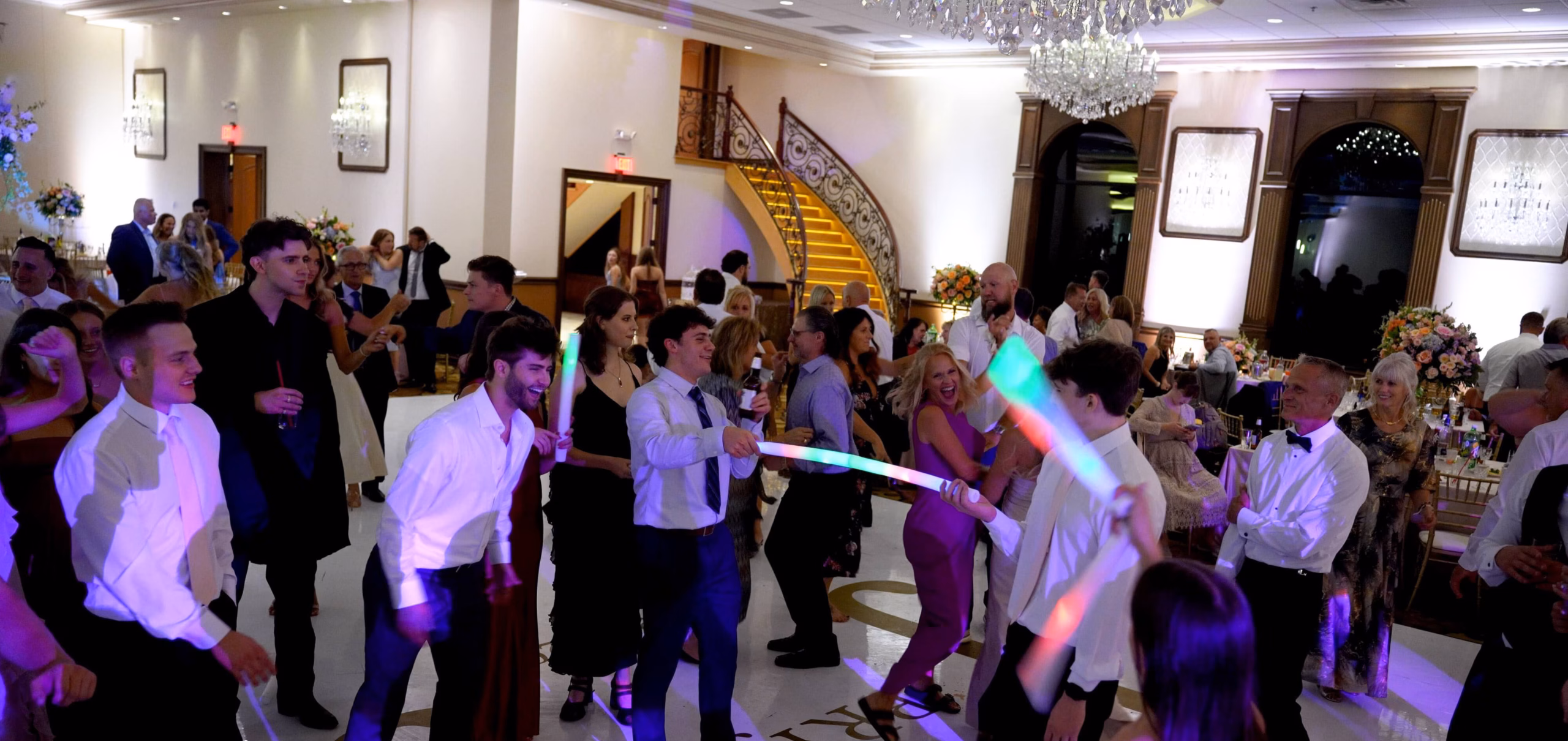 Group of people with glow sticks on the dance floor