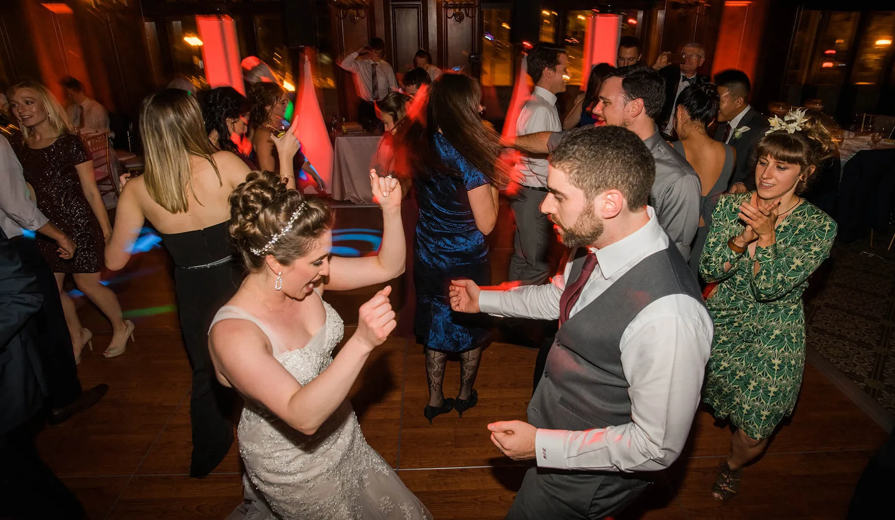 Guests dancing under warm lighting at a University Club of Chicago wedding